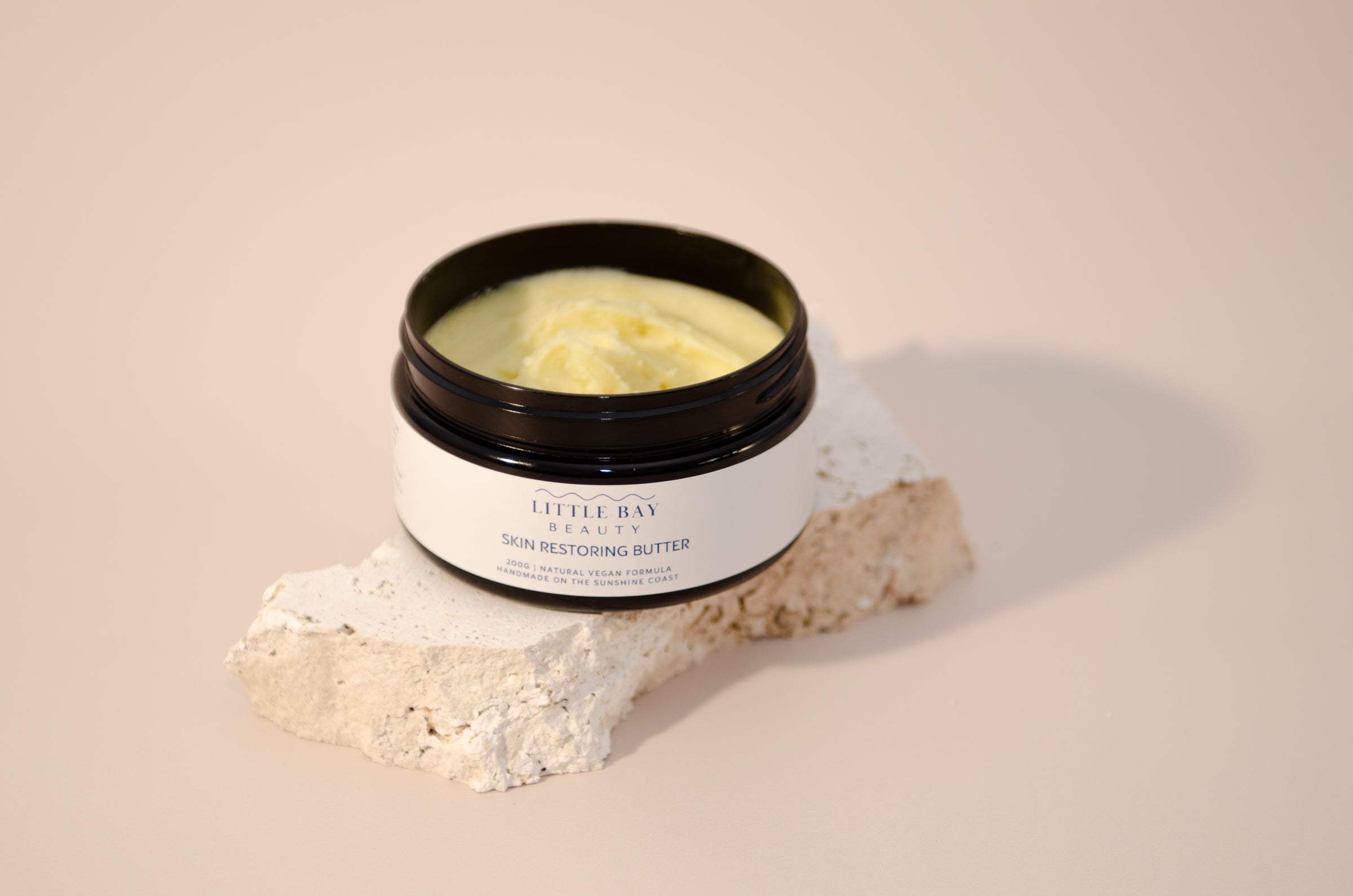 Little Bay Beauty Skin Restoring Butter applied for overnight body slugging ritual